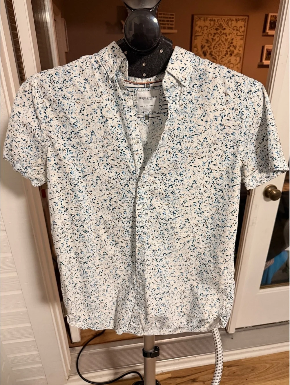 White floral short sleeve button-up shirt